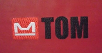 tom-555x278